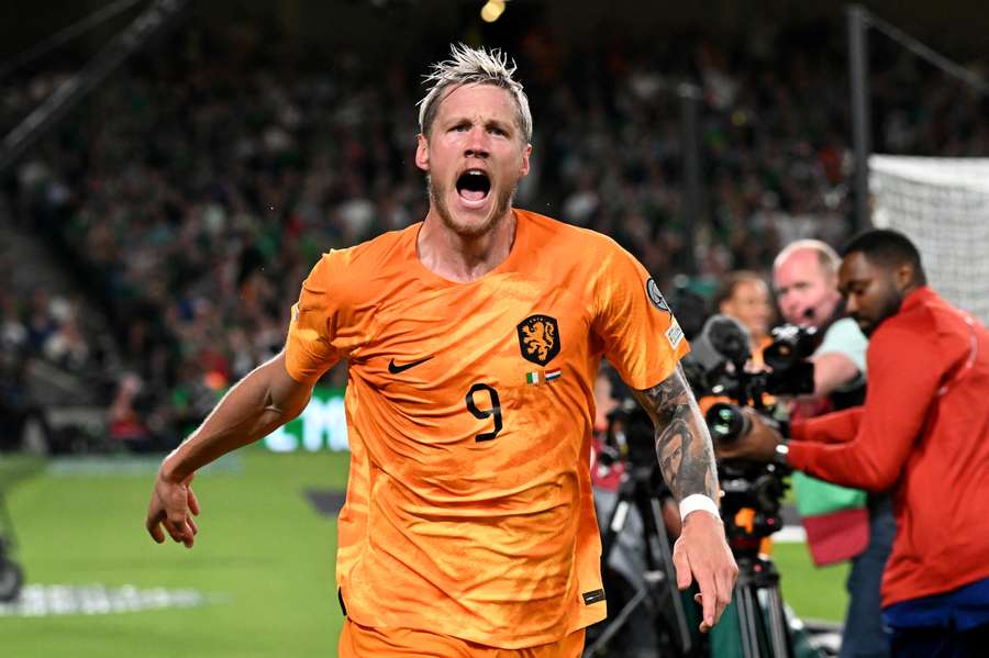 Wout Weghorst runs to celebrate his goal in the orange of the Netherlands