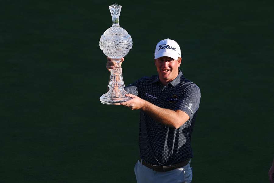 Tom Hoge of the United States celebrates with the trophy after winning during the final round of the AT&T Pebble Beach Pro-Am in 2022