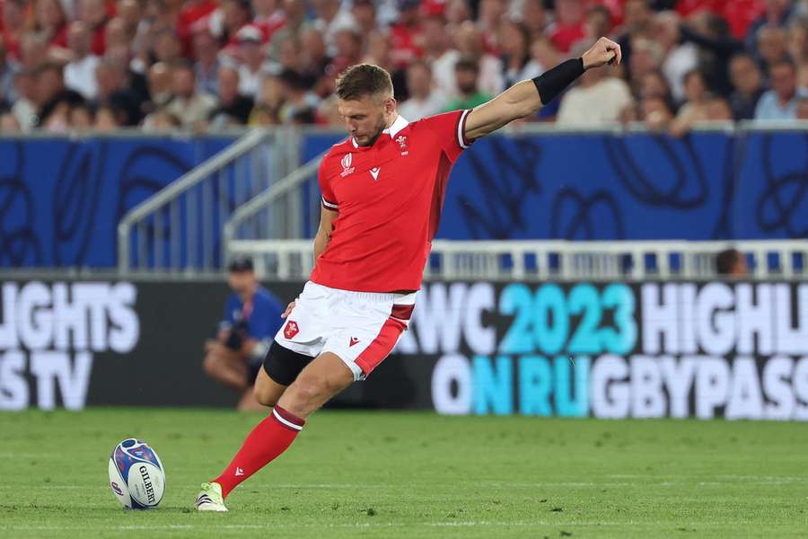 Wales' fly-half Dan Biggar kicks and scores a penalty kick