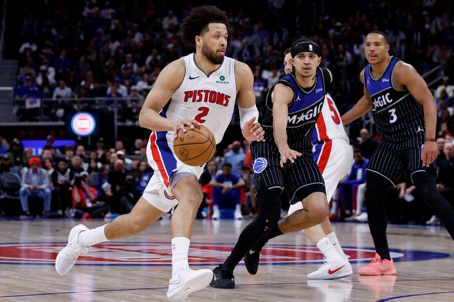 Detroit Pistons guard Cade Cunningham dribbles on Orlando Magic guard Anthony Black