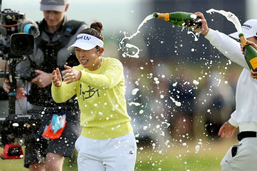 Miyu Yamashita is soaked in champagne after her win