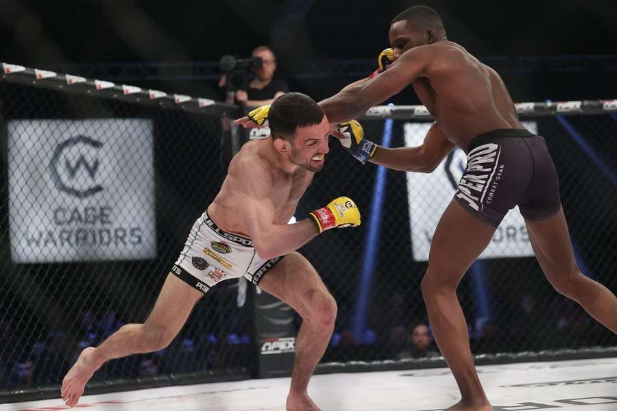Aaron Aby punches Gerardo Fanny during Cage Warriors 136