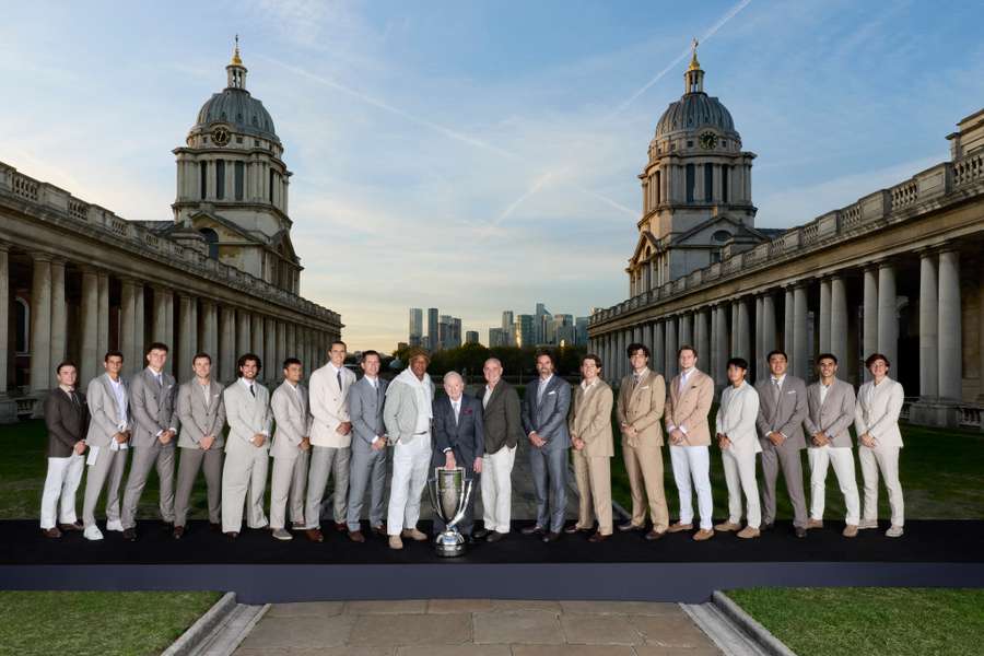 The players and captains pose with the Laver Cup. The players and captains pose with the Laver Cup.