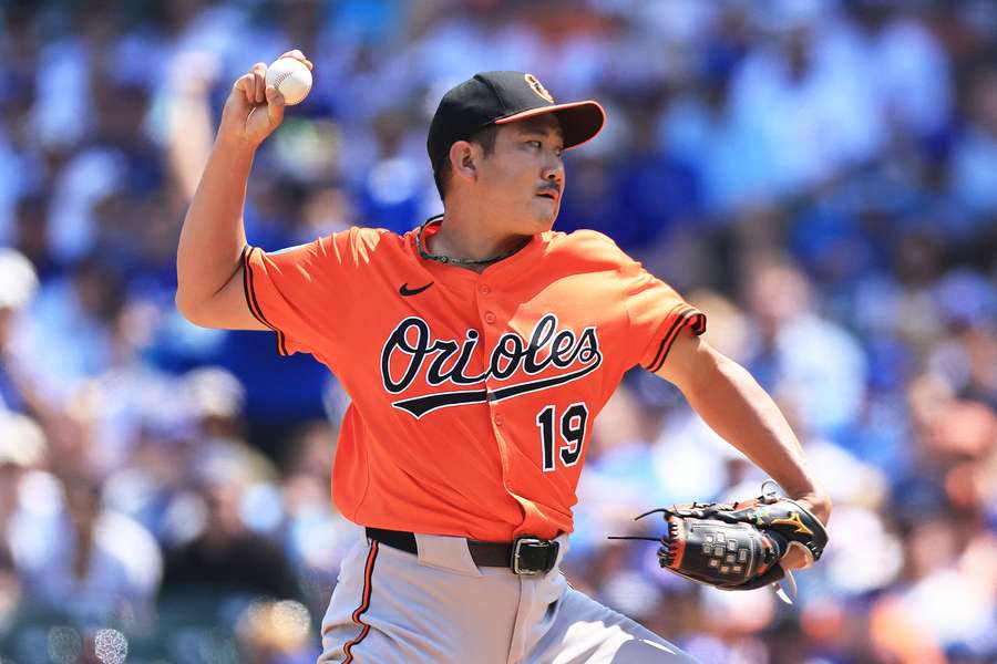 Tomoyuki Sugano throws a pitch