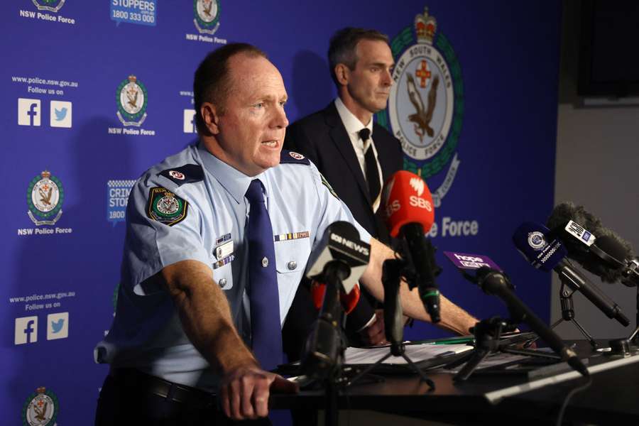 New South Wales assistant police commissioner Michael Fitzgerald (L) speaks during a press conference