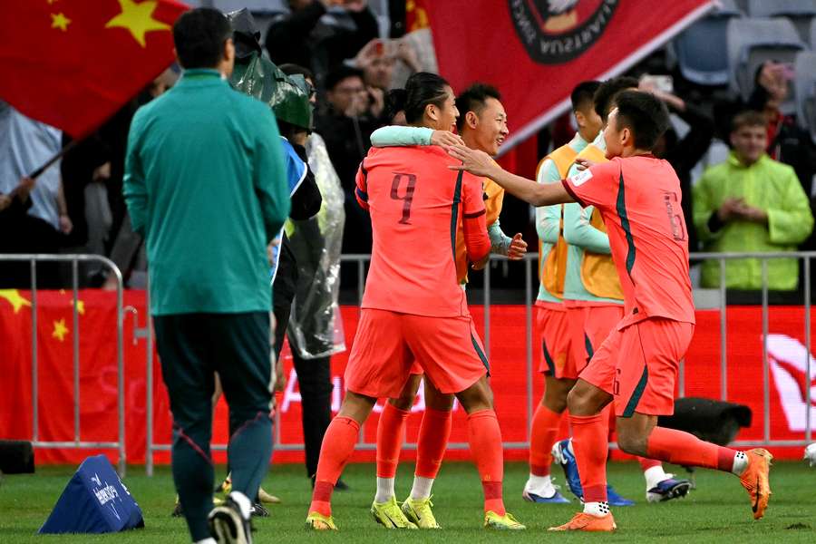 China celebrates one of their two goals scored against Curaçao at Sydney's Accor Stadium on Friday evening. 