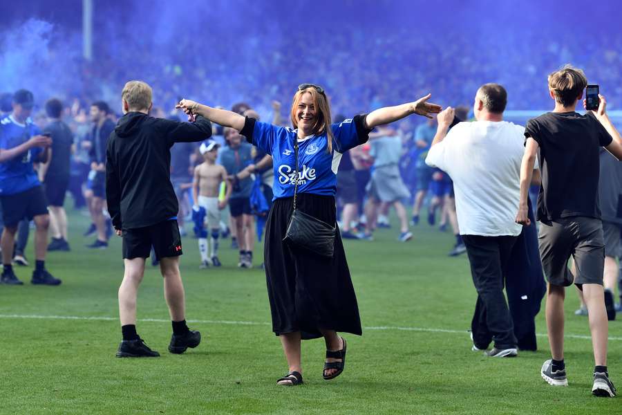Everton supporters invade the pitch to celebrate at the end of the English Premier League football match between Everton and Bournemouth