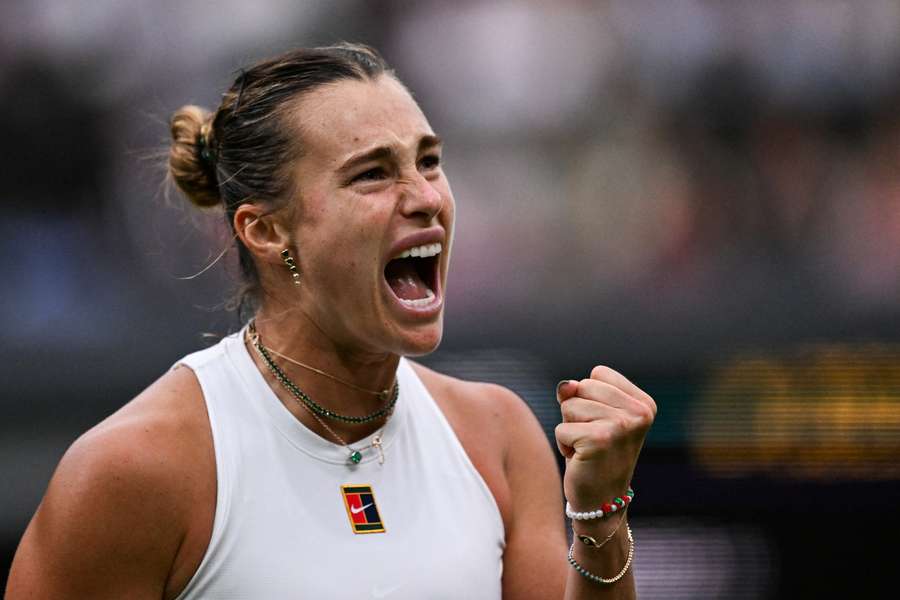Aryna Sabalenka celebrates after winning a point against Elise Mertens