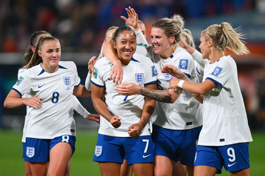 England celebrate with James following her goal