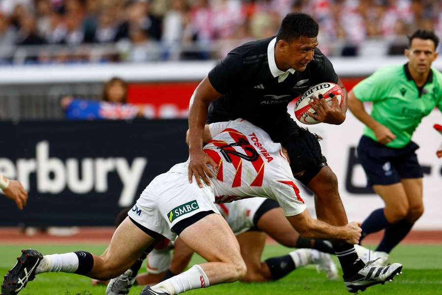 New Zealand's Samipeni Finau runs in a try