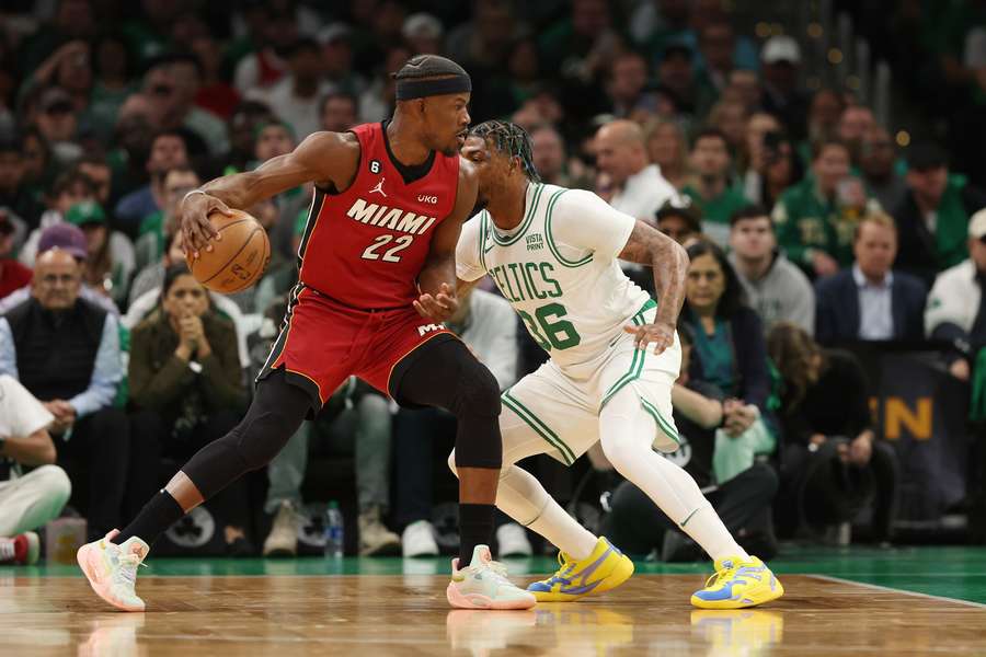 Miami's Butler (L) runs with the ball