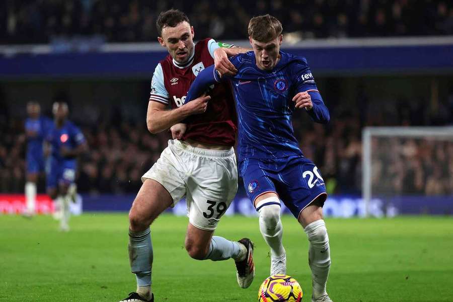 West Ham's Andy Irving challenges Chelsea's Cole Palmer
