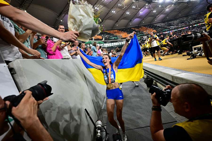 Yaroslava Mahuchikh celebrates her gold medal in front of her fans