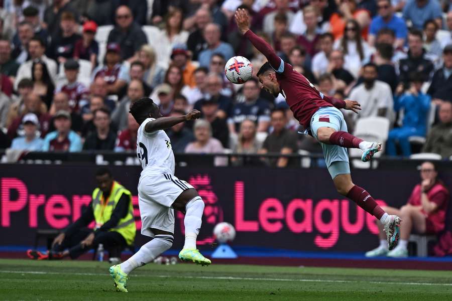 West Ham United's Spanish midfielder Pablo Fornals (R) jumps above Leeds United's Italian striker Wilfried Gnonto to header the ball