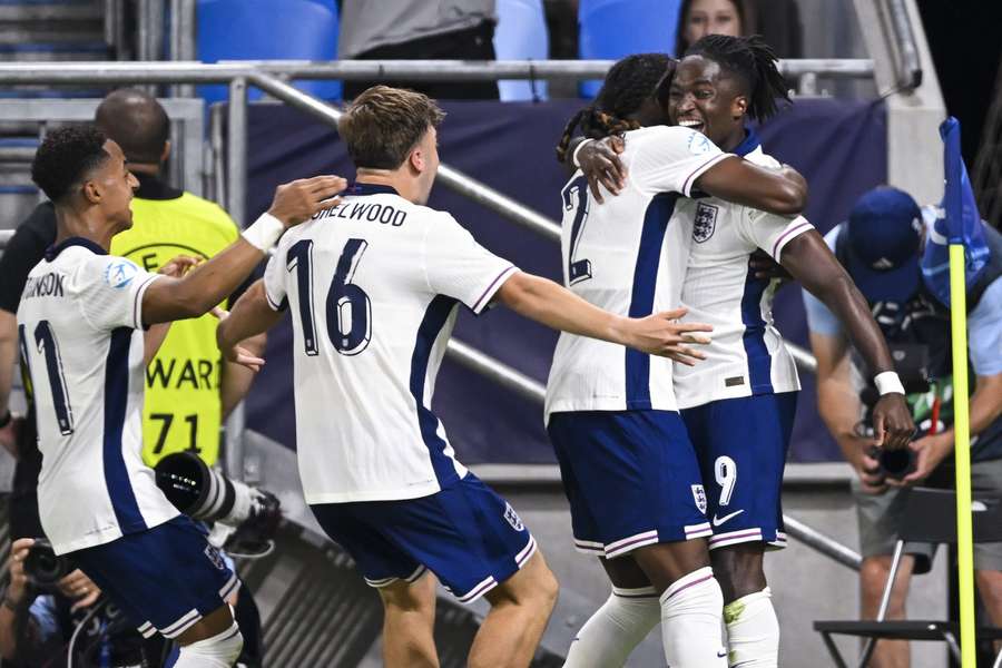 Jonathan Rowe celebrates with team-mates after scoring the winner