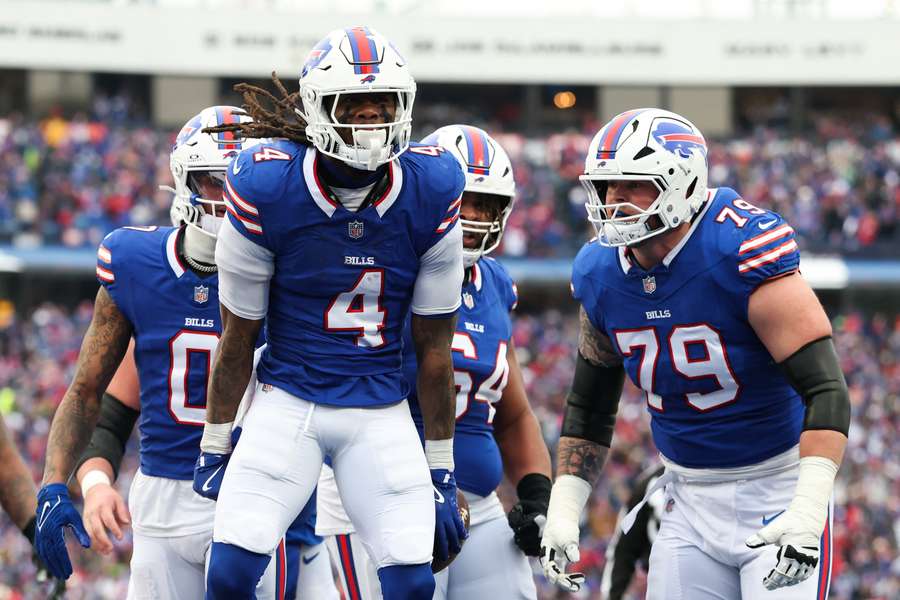 James Cook (#4) of the Buffalo Bills celebrates after scoring a touchdown against the Denver Broncos