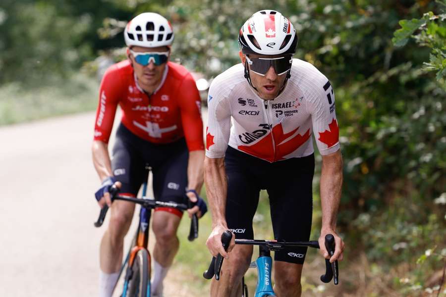 Canadian rider Michael Woods (right) of Israel Premier Tech team competes during the 13th stage