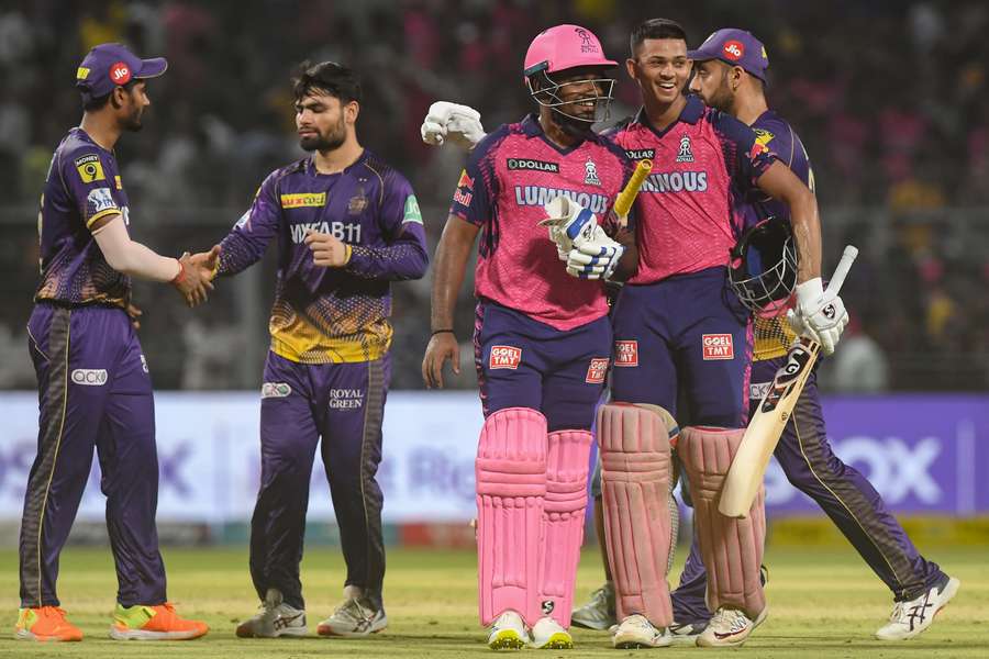 Rajasthan Royals' Yashasvi Jaiswal, second right, and Sanju Samson, centre, celebrate after winning the Indian Premier League match between Kolkata Knight Riders and Rajasthan Royals