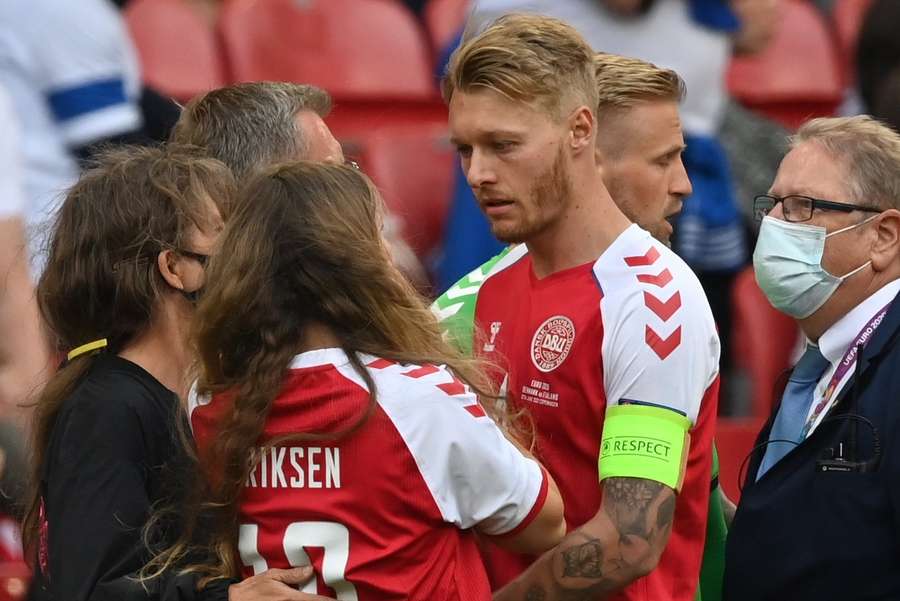 Simon Kjaer comforts Christian Eriksen's girlfriend Sabrina Kvist Jensen after Eriksen had suffered a cardiac arrest at the EURO 2021 Simon Kjaer comforts Christian Eriksen's girlfriend Sabrina Kvist Jensen after Eriksen had suffered a cardiac arrest at the EURO 2021