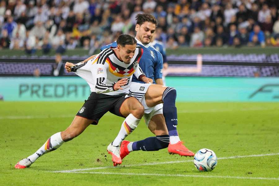 Younes Ebnoutalib of Germany and Konstantinos Mavropanos of Greece during a UEFA Nations League game