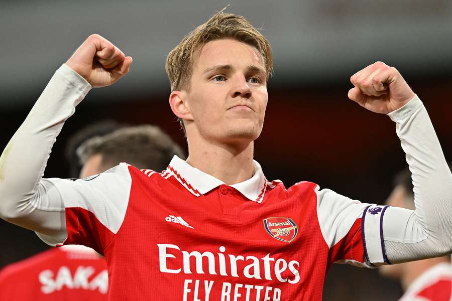 Arsenal's Norwegian midfielder Martin Odegaard celebrates scoring the team's third goal