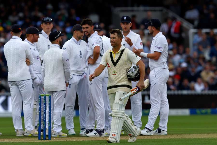 Australia's David Warner (C) walks back to the pavilion after losing his wicket for 25 runs Australia's David Warner (C) walks back to the pavilion after losing his wicket for 25 runs