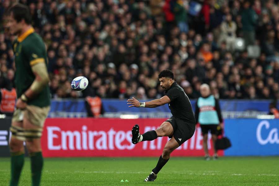 Richie Mo'unga kicking the ball during the 2023 World Cup final. Richie Mo'unga kicking the ball during the 2023 World Cup final.