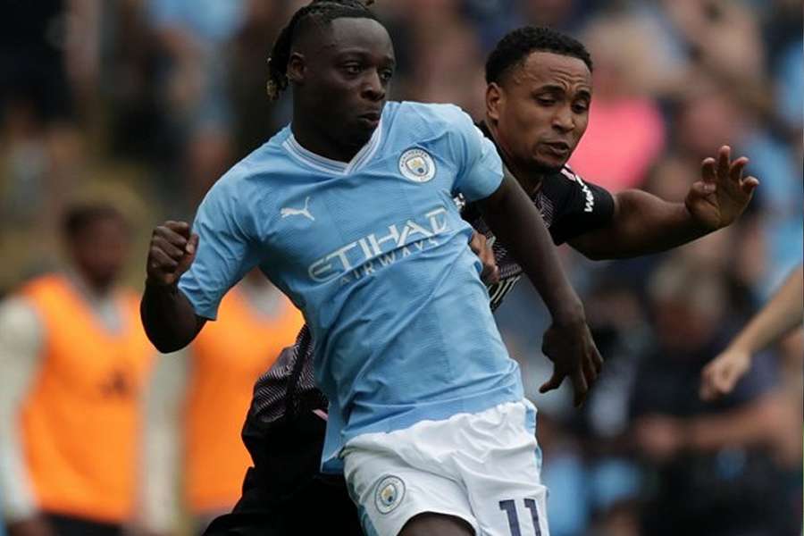 Manchester City manager Pep Guardiola reacts after Manchester City's Jeremy Doku scores his side's third goal 