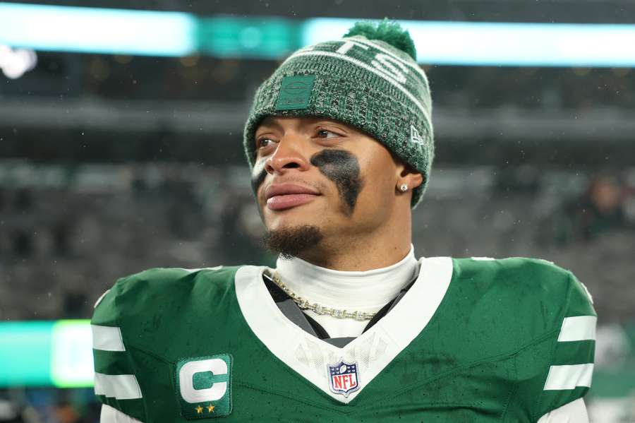 Quarterback Justin Fields looks on after a game