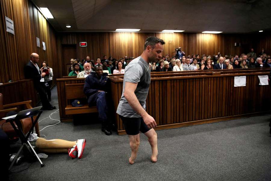 Pistorius walks across the court room during his trial