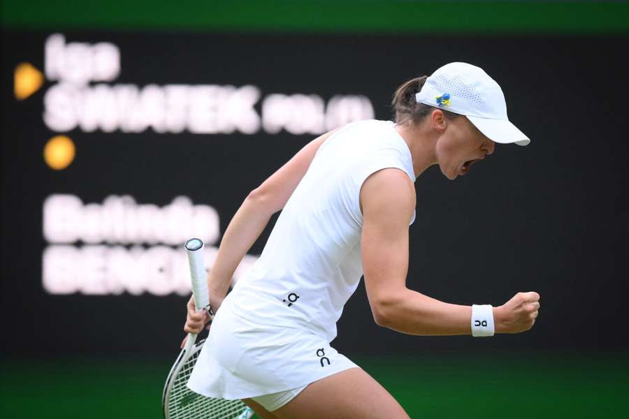 Poland's Iga Swiatek celebrates winning against Switzerland's Belinda Bencic