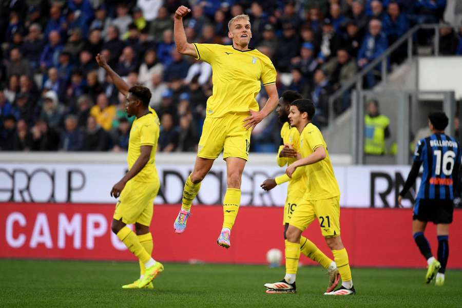 Isaksen (centre) celebrates his winning goal for Lazio