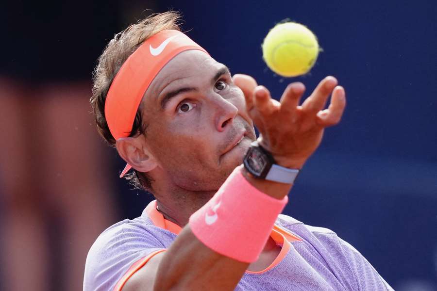 Spain's Rafael Nadal serves the ball to Italy's Flavio Cobolli