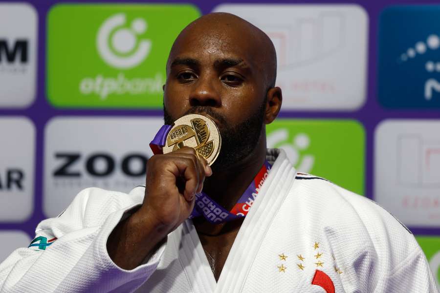 France's Teddy Riner celebrates with his gold medal on the podium