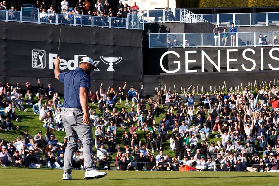 The crowd cheers as Rahm completes the third round of the Genesis Invitational