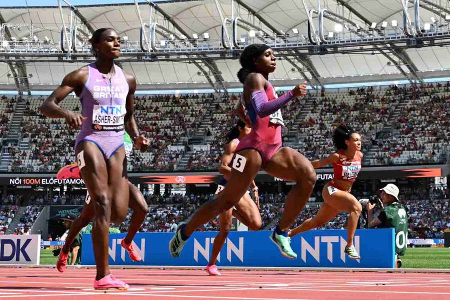 Dina Asher-Smith crosses the line with USA's Brittany Brown and Spain's Jael Bestue