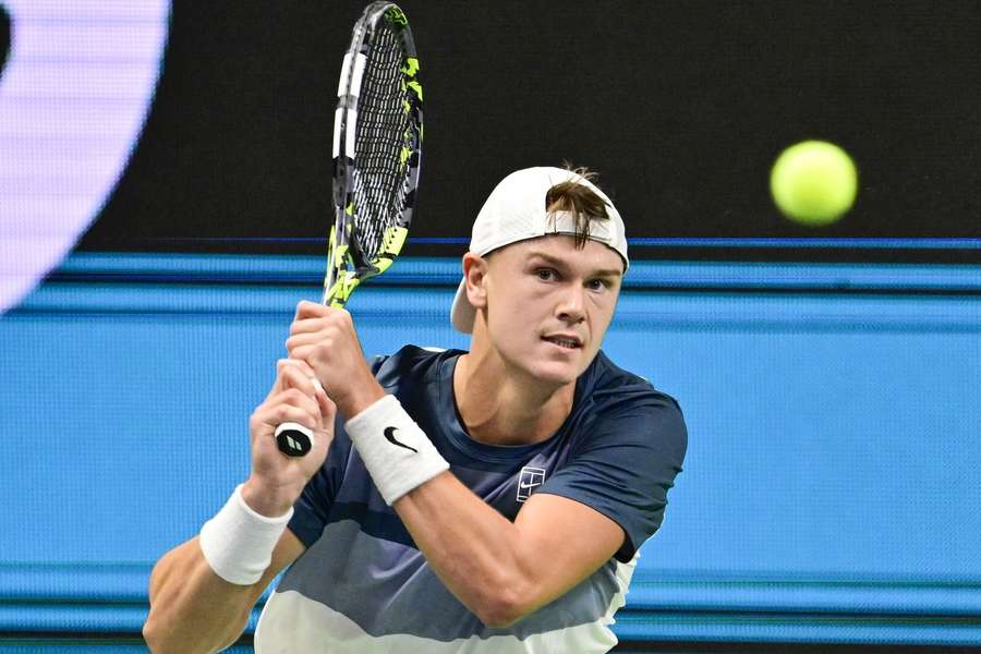 Rune returns a serve against Fucsovics