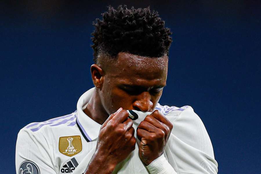 Vinicius Junior kisses the Real Madrid crest