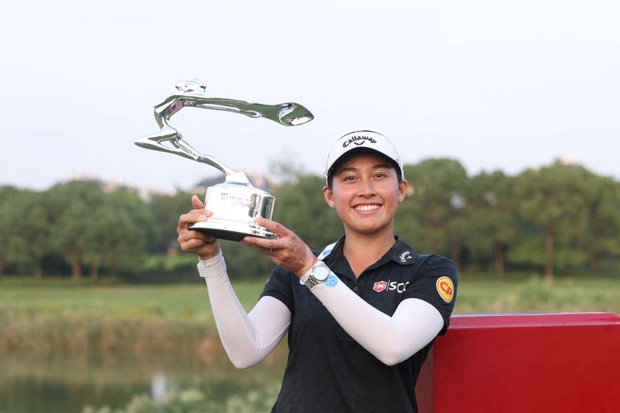 Jeeno Thitikul poses with the trophy after winning the final round of the Buick LPGA Shanghai