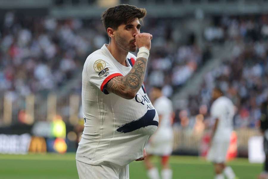 Paris Saint-Germain's Lucas Beraldo celebrates scoring their third goal against Angers