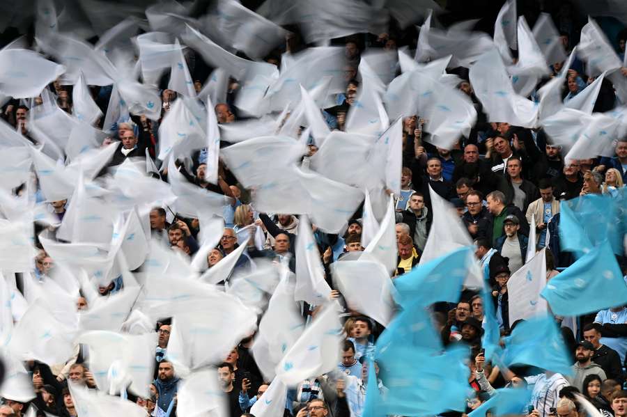 Man City fans wave flags ahead the match Man City fans wave flags ahead the match