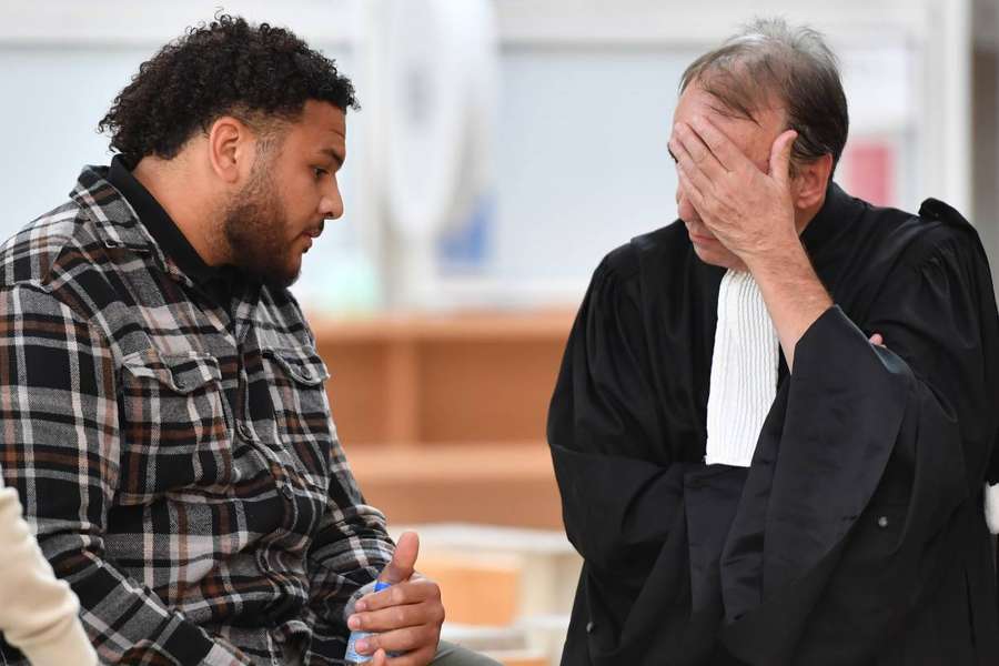 French international rugby player Mohamed Haouas speaks with his lawyer Marc Gallix