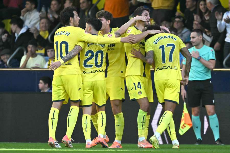 Villarreal's players celebrate their first goal