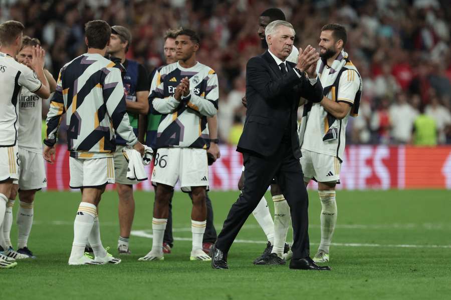 Real Madrid's Italian coach Carlo Ancelotti applauds at the end of the UEFA Champions League 1st round day 1 group C football match between Real Madrid and Union Berlin