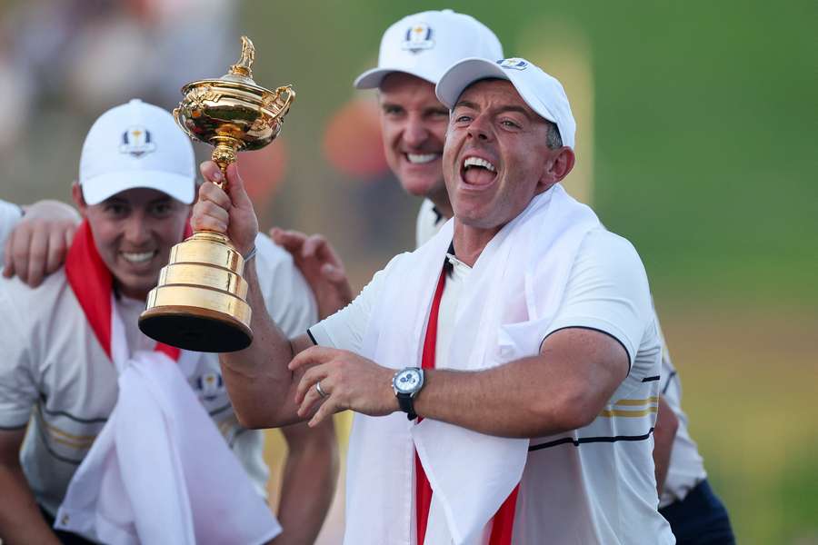 Rory McIlroy celebrates with the Ryder Cup trophy earlier this year Rory McIlroy celebrates with the Ryder Cup trophy earlier this year