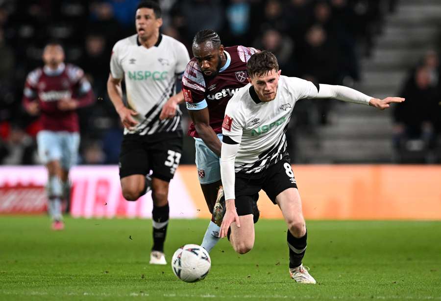 Derby County midfielder Max Bird takes on Michail Antonio