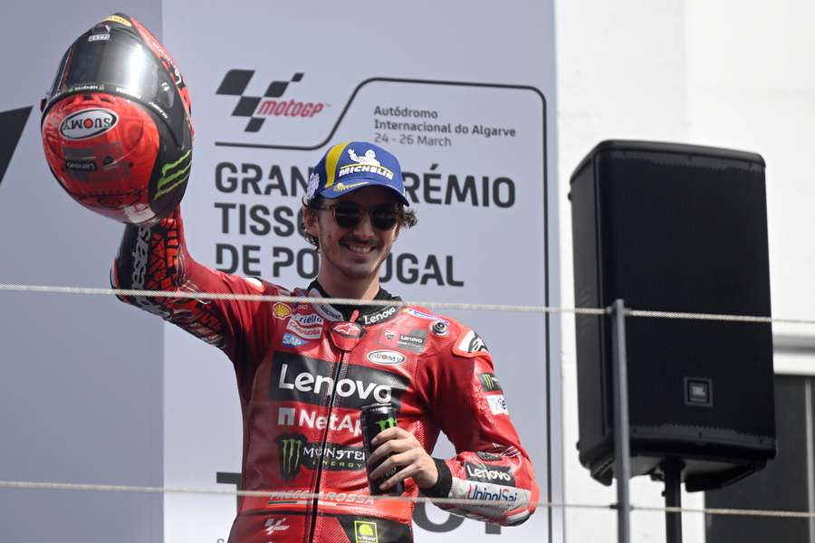 Ducati Italian rider Francesco Bagnaia celebrates on the podium winning the MotoGP race of the Portuguese Grand Prix