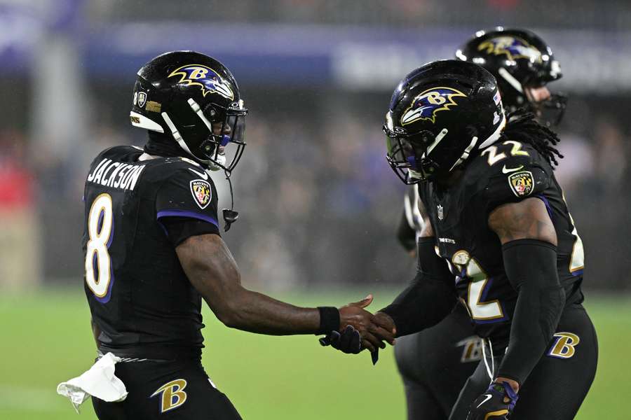 Derrick Henry (right) celebrates a touchdown with Lamar Jackson