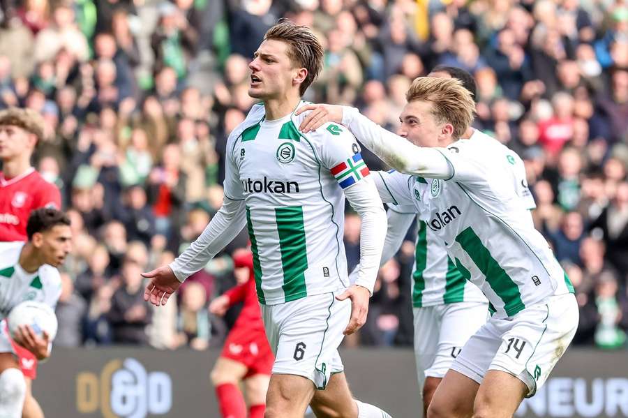 FC Groningen captain Stije Resink (L) celebrates scoring a goal against FC Twente FC Groningen captain Stije Resink (L) celebrates scoring a goal against FC Twente