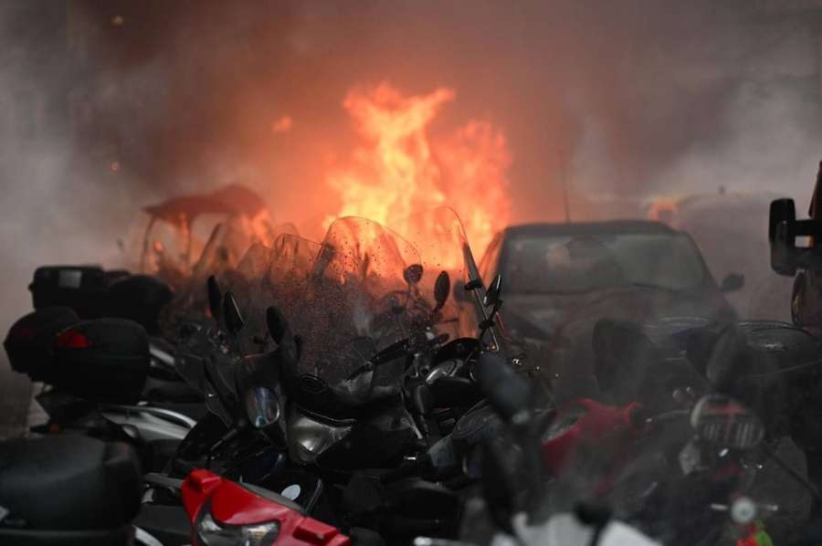 A car was set alight as supporters clashed with police in Napoli